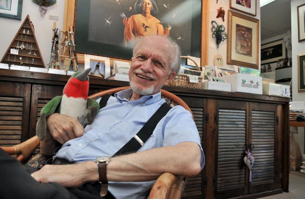 Hummingbird Society founder H. Ross Hawkins, Ph.D., kicks back in his Village of Oak Creek shop Friday, July 20, with a toy hummingbird. Hawkins will help host the inaugural Sedona Hummingbird Festival beginning Friday, Aug. 3, at the Sedona Performing Arts Center. The three-day event will include presentations, field trips, photography and demonstrations.