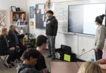 Angel Martinez and Alexis Pedroza deliver their Civil Action Project presentation “Sedona’s Poisoning” about littering to their classmates as well as Sedona Mayor Scott Jablow and Vice Mayor Holli Ploog, seated left, during government class at Sedona Red Rock High School on Friday, Dec. 8. David Jolkovski/Larson Newspapers